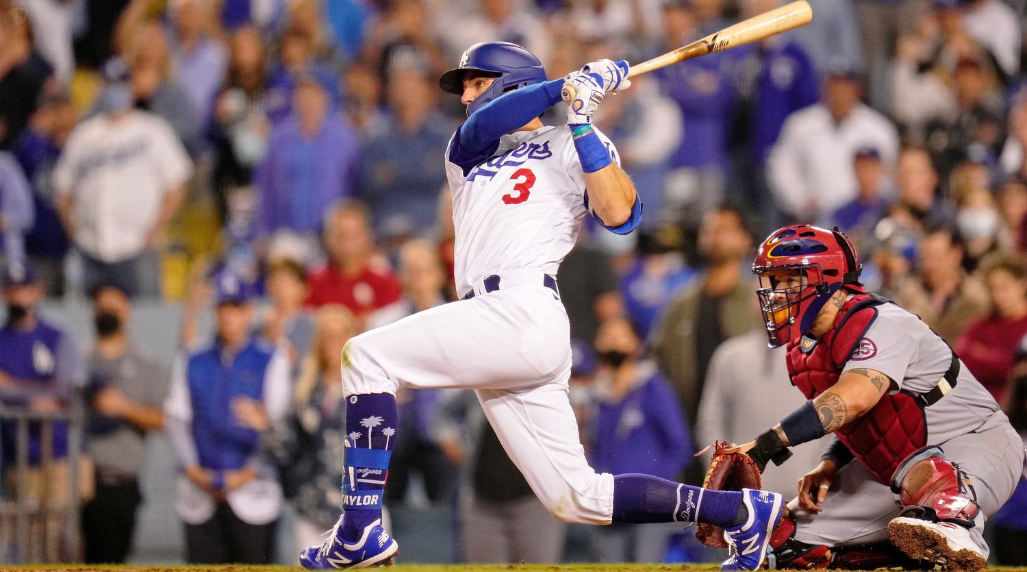 Oct 6, 2021; Los Angeles, California, USA; Los Angeles Dodgers left fielder Chris Taylor (3) hits a walk-off two run home run against the St. Louis Cardinals during the ninth inning at Dodger Stadium. The Los Angeles Dodgers won 3-1.